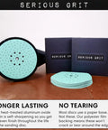 Heavy Duty 9-Hole 40 Grit Drywall Sanding Discs For Festool Planex LHS 225 Sanders with packaging on table