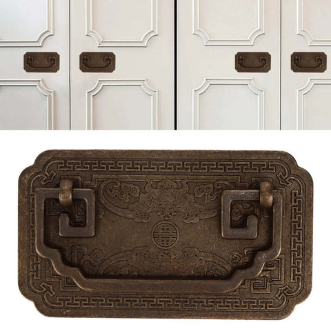 Antique Bat Style Brass Drawer Pull Handle With Two Screws for cabinets, showing intricate details and brass finish on white doors.