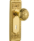 Vintage Egg And Dart Interior Door Knob With Matching Backplate features ornate brass design and keyhole for classic charm.