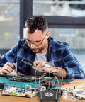 Man using Adjustable Soldering Support Tool With Universal Clamp And Helping Hands, Pro Grade Soldering Station Kit for repair