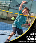 Child playing tennis with a Portable 14 Foot Multi Sport Net For Badminton, Pickleball, Tennis And Soccer Tennis With Foldable And Extendable Poles, Adjustable Height Up To 60 Inches, Easy Setup, Backyard Ready, Black.