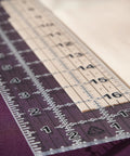 Seam Ready Sewing Ruler 3 By 18 Inch Acrylic Grid Ruler With Highlighted Seam Allowances for craft projects on fabric surface