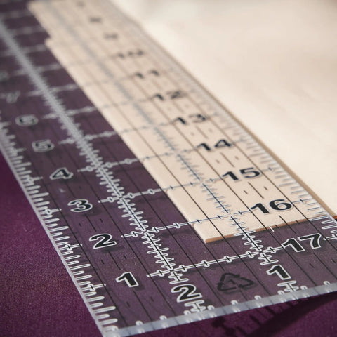 Seam Ready Sewing Ruler 3 By 18 Inch Acrylic Grid Ruler With Highlighted Seam Allowances for craft projects on fabric surface