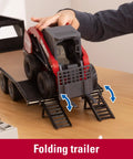 Child placing skid steer on RAM 2025 Dealership Truck With Case IH Skid Steer And Gooseneck Trailer 1 16 Scale for play
