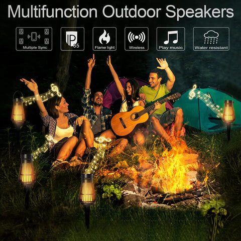 Camping scene with Lit LED Flame Tiki Torch Bluetooth Speaker Set With Flickering Flame TWS True Wireless Stereo Pairable
