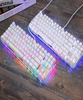 Legit Wired Gaming Keyboard With Hella Smooth Mechanical Feel And Straight Fire RGB Rainbow Backlight Featuring Nine Custom Lighting Modes Plus Six Key N Key Rollover And Multimedia Keys For Ultimate Windows Pc Gaming Setup on a wooden desk.