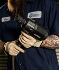 Mechanic holding impact wrench using 1/2 Inch Drive Impact Socket Set, 19-Piece SAE, Cr-Mo Alloy Steel, Radius Corner Design