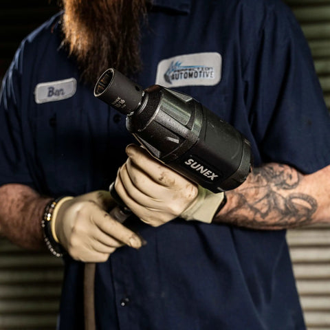 Mechanic holding impact wrench using 1/2 Inch Drive Impact Socket Set, 19-Piece SAE, Cr-Mo Alloy Steel, Radius Corner Design