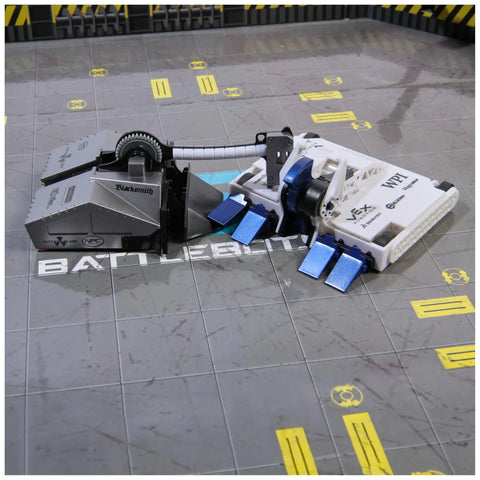 Hella Entertaining BattleBots Arena Remote Control Robot Building Kit With Twenty Plus Pieces Boss Level STEM Project For Girls Boys Seven Plus Totally Sick Combat Action Set showing Blacksmith and bite force robots in action on the arena.