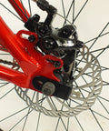 Close-up of Salire SJ-50 Dirt Jumper Bike With Disc Brakes And 26 Inch Wheels, highlighting beefy steel frame and brake mechanism.