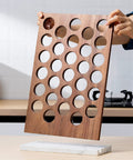Person assembling K Cup Coffee Pod Holder And Organizer with Acacia Wood Storage Rack and Weighted White Marble Base, 30 Pod Capacity.