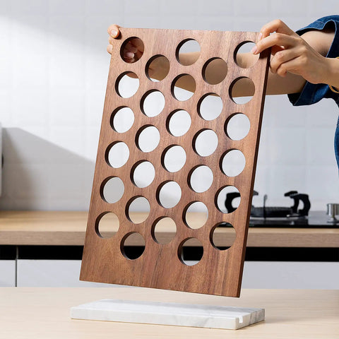 Person assembling K Cup Coffee Pod Holder And Organizer with Acacia Wood Storage Rack and Weighted White Marble Base, 30 Pod Capacity.