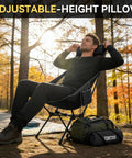 Man relaxing in Ultra Lightweight Portable High Back Camping Chair With Head Support 440 Lbs Capacity, outdoor setting.