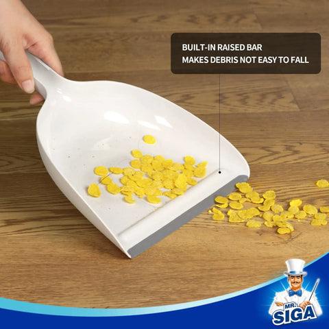 Portable Dustpan and Brush Set With Bamboo Handle in White for Quick Cleanups at Home, showing debris on dustpan with raised bar
