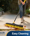 Heavy Duty 24 Inch Push Broom With Adjustable Telescoping Handle Up To 65 Inches used for sweeping leaves on pavement.