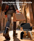 Person carrying Crush20 Acoustic Guitar Amp With Reverb And 20W Power, showing detachable leather handle.