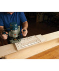 Woodworker using Top Shelf Cleaver Style Cutting Board Router Template, Heavy Duty Clear Acrylic Charcuterie Jig.