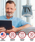 Man using tablet with TrunkNets Inc. logo and service icons for Dodge Durango Trunk Mesh Cargo Net Envelope Style