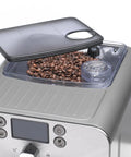 Super Automatic Espresso Machine With One Touch Brewing Delivers Solid Daily Grinds And Straight Fire Shots That Hit Different Every Time In A Sleek Silver Body Made For Zero Hassle Home Brewing with open bean hopper and beans.