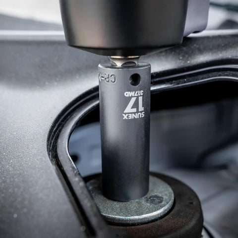 Close-up of a 17mm socket from the Three Eighth Inch Drive Impact Socket Set, Beefy 51 Piece Metric And SAE Master Kit in use on a bolt