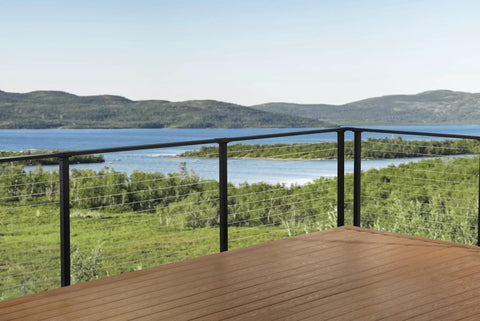 No Headache DIY Cable Railing Kit 30 Ft Black Face Mount Deck Railing System with Marine Grade Stainless Steel Wire on a scenic deck.