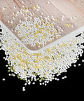 No Nonsense Heavy Duty Hot Melt Edgebander Glue 11 Lb High Viscosity Adhesive Pellets on wood surface for edge banding.