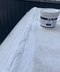 Heavy Duty Silicone Roof Patch Kit 2 Gallon Black for Preventing Leaks and Total Waterproofing applied on RV roof, showing finished seal.