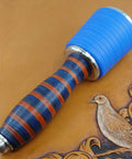 Professional Leather Tooling Maul With Tough Nylon Head And Real Veg Tan Leather Handle on leather background.
