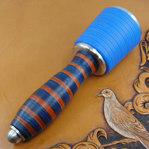 Professional Leather Tooling Maul With Tough Nylon Head And Real Veg Tan Leather Handle on leather background.