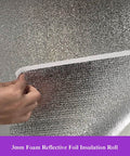 Close-up of Double Sided Aluminum Foil Insulation Roll With 3mm Foam Core, showing foil layers and foam core detail