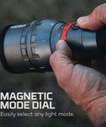 Close-up of hand adjusting magnetic mode dial on 12,000 Lumen Handheld Flashlight With 5 Lighting Modes USB-C Rechargeable Waterproof Tactical Floodlight For Hiking Camping Hunting Self Defense And Go-To Outdoor Adventures