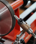 Close-up of Top Shelf Woodturning Lathe Tool Rest Sharpening System Kit for chisels, showcasing CBN wheel and holder setup.
