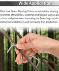 Hand using Open Angle Branch Pullers Set For Fruit Trees 100 Pack With 4.4 Inch And 3.4 Inch Branch to shape tree limb