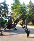 BH6600HT Beefy Heavy Duty 3 Point Hitch Backhoe attached to tractor, showing 7 ft digging arm and bucket on pavement