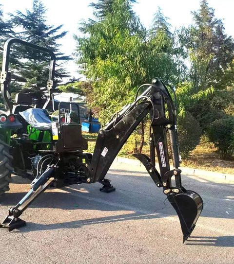 BH6600HT Beefy Heavy Duty 3 Point Hitch Backhoe attached to tractor, showing 7 ft digging arm and bucket on pavement