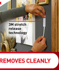 Using Hanging Made Easy With Sawtooth Picture Hangers Kit to remove strip cleanly from wall with stretch release technology.