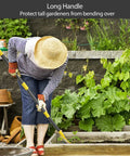 Gardener using Heavy Duty Metal Garden Rake for Leaves and Lawn, adjustable handle in vegetable garden