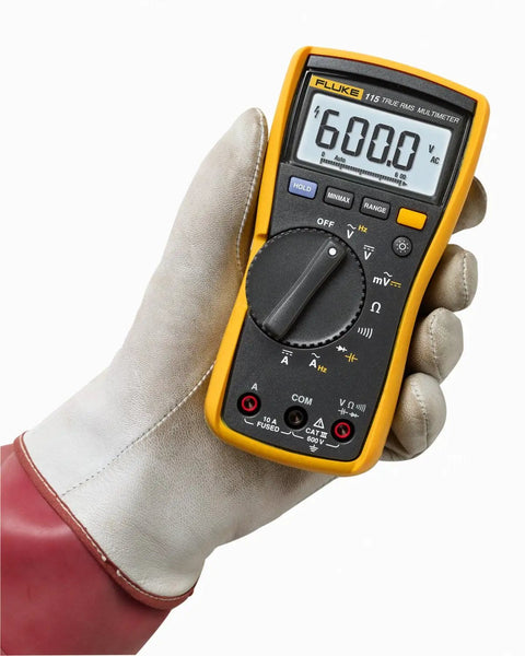 Gloved hand holding Compact On-The-Go True RMS Multimeter For Field Technicians With Voltage And Current Measurement, CAT III 600V.