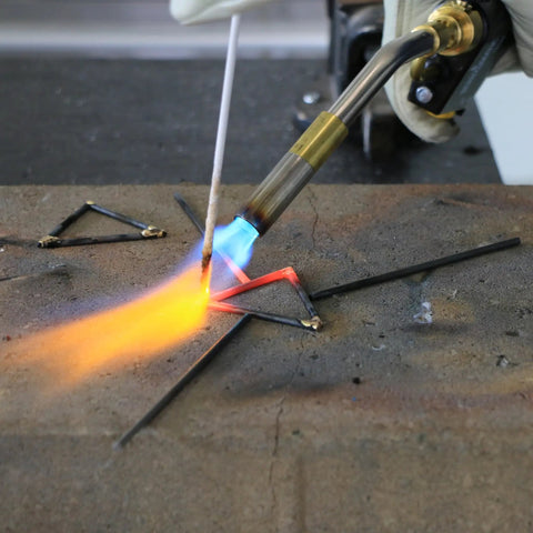 Trigger Start Butane Torch TS8000 With Beast Heat And Instant On Off Ignition in use for brazing metal rods on a workbench