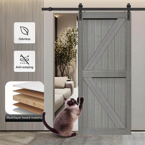 32x84 Inch MDF Light Gray Barn Door with 6.6 Ft Sliding Hardware Kit installed in a living room with visible layering and a cat nearby