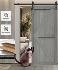 Top Tier Sliding Barn Door Measures 32 By 84 Inches In Striking Elephant Gray Solid Mdf Panel With Tough Waterproof Pvc Coat And Smooth Glide Track Kit For Hassle Free Room Zoning And Clean Home Vibe Additions, shown with a cat in a modern living space.