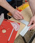 Man using a pencil on metal for precise measurements with a Precision Router Table Insert Slide Like Butter With Dead On Accurate Metric Measurements.