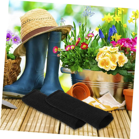 Heavy Duty Cut Resistant Arm Guards And Thorn Proof Work Sleeves on wooden surface with gardening equipment and flowers in background.