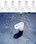 Arcade Console PCB Mounting Feet With Screws White L Shaped Plastic Standoffs attached to blue circuit board