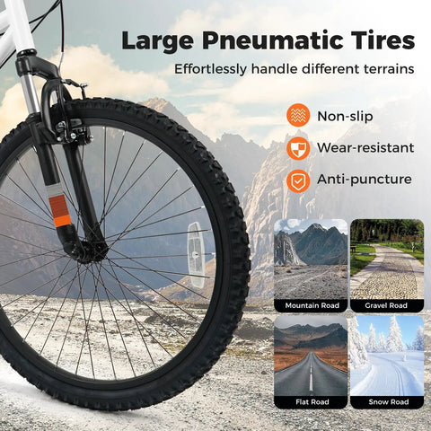 Close-up of kids mountain bike tire on rough terrain, showing large pneumatic tires with non-slip and wear-resistant features.