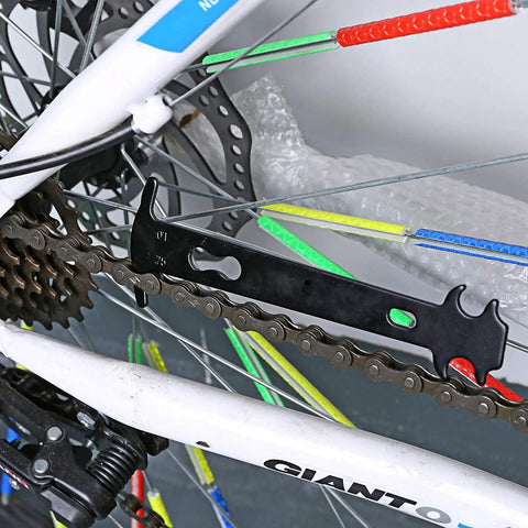 All In One Bike Chain Repair Kit With Master Link Pliers Chain Wear Gauge And Six Pairs Missing Links For 6 7 8 9 10 Speed Chains Quick Link Plier Tool For Fast Pro Bike Maintenance showing wear gauge on bike chain