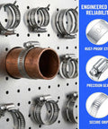 30Pcs 304 Stainless Steel Hose Clamps Set With 6-51mm Adjustable Worm Gear Clamps on a pegboard with copper pipe