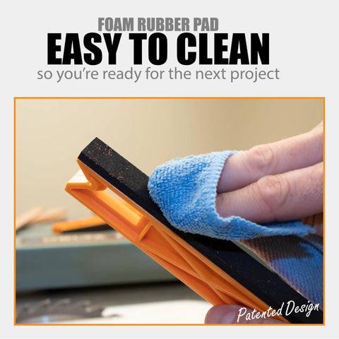 Person cleaning foam base of 2 In 1 Safety-V Push Sticks For Table Saw, Band Saw, Jointer And Router Table Dual Mode