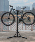 Heavy Duty Bike Repair Stand With Hand Crank Mechanical Lift, Max 110 Lbs Load, supporting mountain bike outdoors