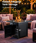 28 Inch Propane Fire Pit Table With 50,000 BTU Heat for Backyard Parties on patio with hidden propane tank storage open
